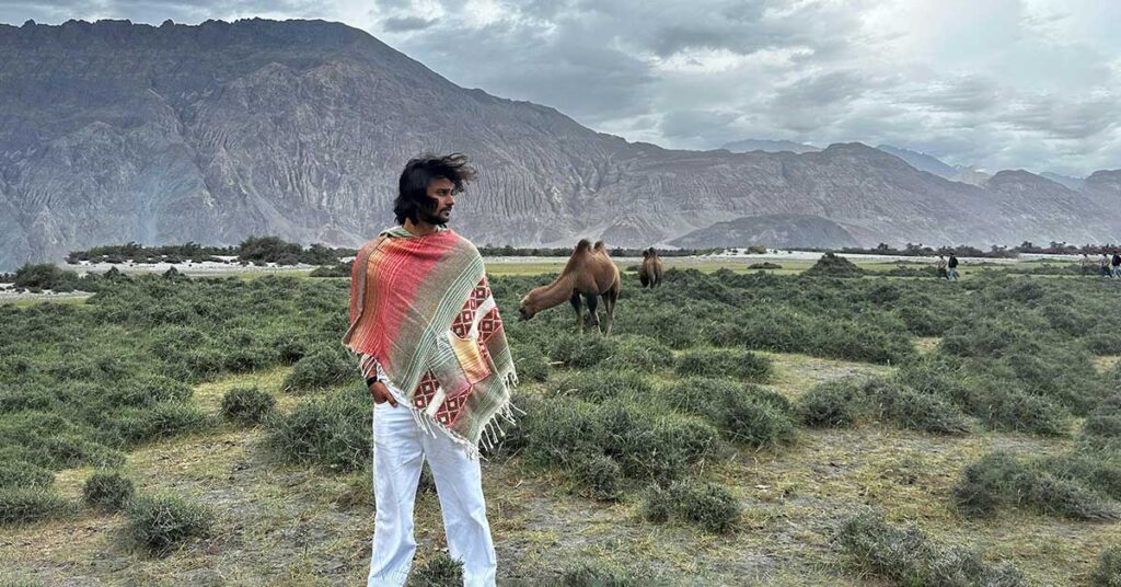 man wearing a woollen poncho in Ladakh