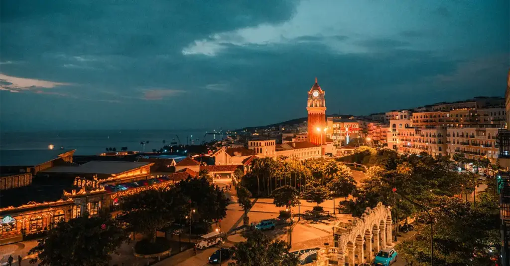 Aerial sunset view of Grand World Phu Quoc's clock tower and waterfront