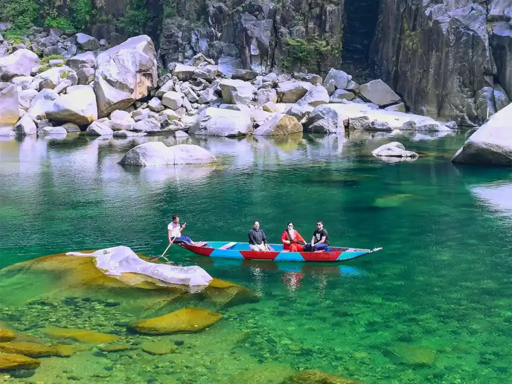 From the Double Decker Root Bridge to Dawki's glass river and Nohkalikai Falls, here are the 10 best places in Meghalaya — with real distances, tips, and what to expect.