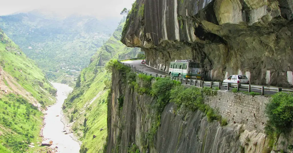 HRTC bus on the cliff-cut Hindustan-Tibet Highway above the Sutlej river in Kinnaur on the Shimla route to Spiti Valley